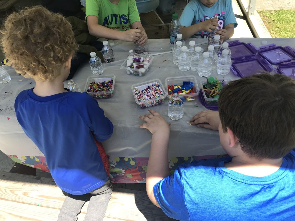These children stopped by the Grundy Woman's Club table to take a break from the festivities to make their own 'calm down' bottles.