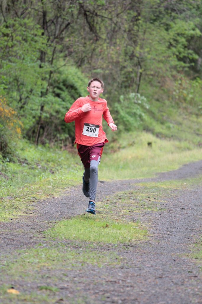 Kaleb Elswick (20:04:76) completes his run in the Buchanan County Autism Awareness 5K Walk/Run.